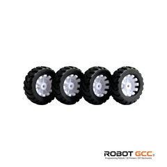 Four black wheels with white spikes on a white background, featuring the ROBOT GCC logo.