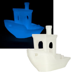 Blue and white toy boats on a black and white background
