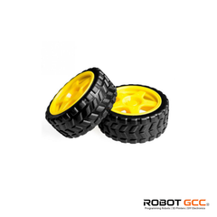Two black off-road tires with yellow centers on a white background, featuring the ROBOT GCC logo.