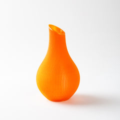 Orange ribbed vase on a white background