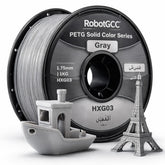 Spool of RobotGCC gray 3D printing filament with printed models on a white background