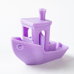 Purple toy boat on a white background