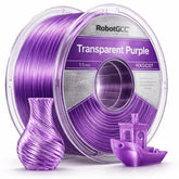 Spool of transparent purple 3D printing filament with a small purple object and a boat model on a white background.