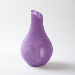 Purple ribbed vase on a white background