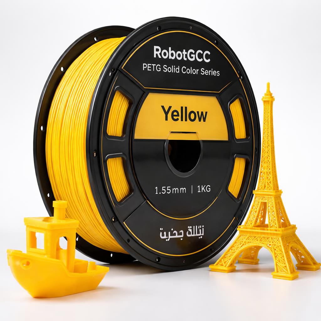 Spool of yellow 3D printing filament with small models of the Eiffel Tower and a boat on a white background.
