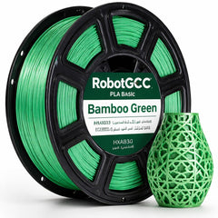 Spool of RobotGCC Bamboo Green 3D printing filament with a printed green vase.