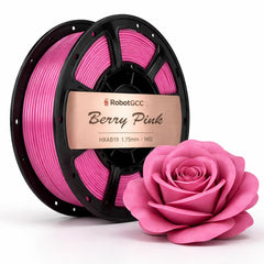 Spool of Berry Pink 3D printing filament with printed objects on a white background
