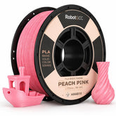 Spool of Peach Pink 3D printing filament with printed objects on a white background