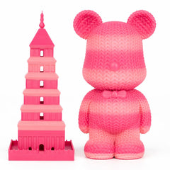 Pink toy bear and pink tower model on a white background