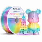 Spool of rainbow-colored filament and a colorful 3D printed object on a white background