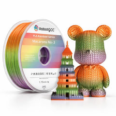 Spool of rainbow-colored 3D printing filament and a knitted toy with a colorful tower model.