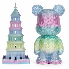 Colorful toy figure with a tower-like structure on a white background