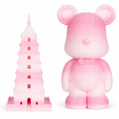 Pink teddy bear and pink tower model on a white background