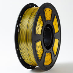 Spool of yellow filament on a white background
