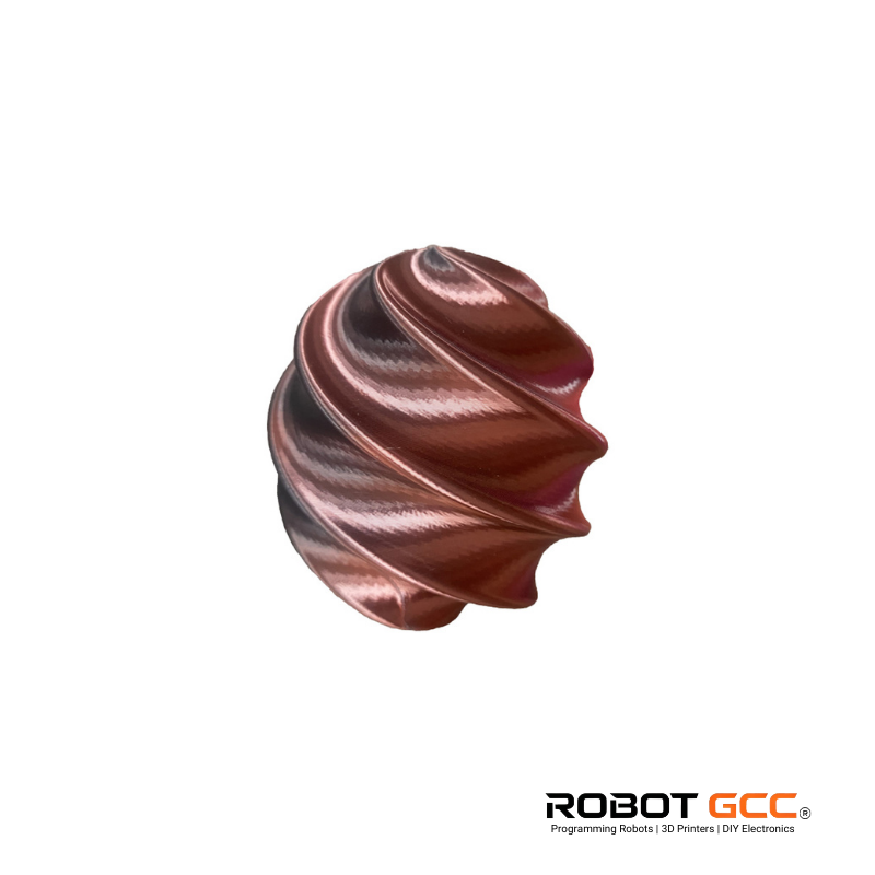 Metallic swirled object on a white background with Robot GCC logo.