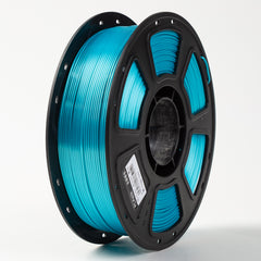 Spool of blue filament on a white background