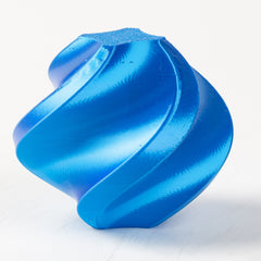 Blue metallic object on a white background