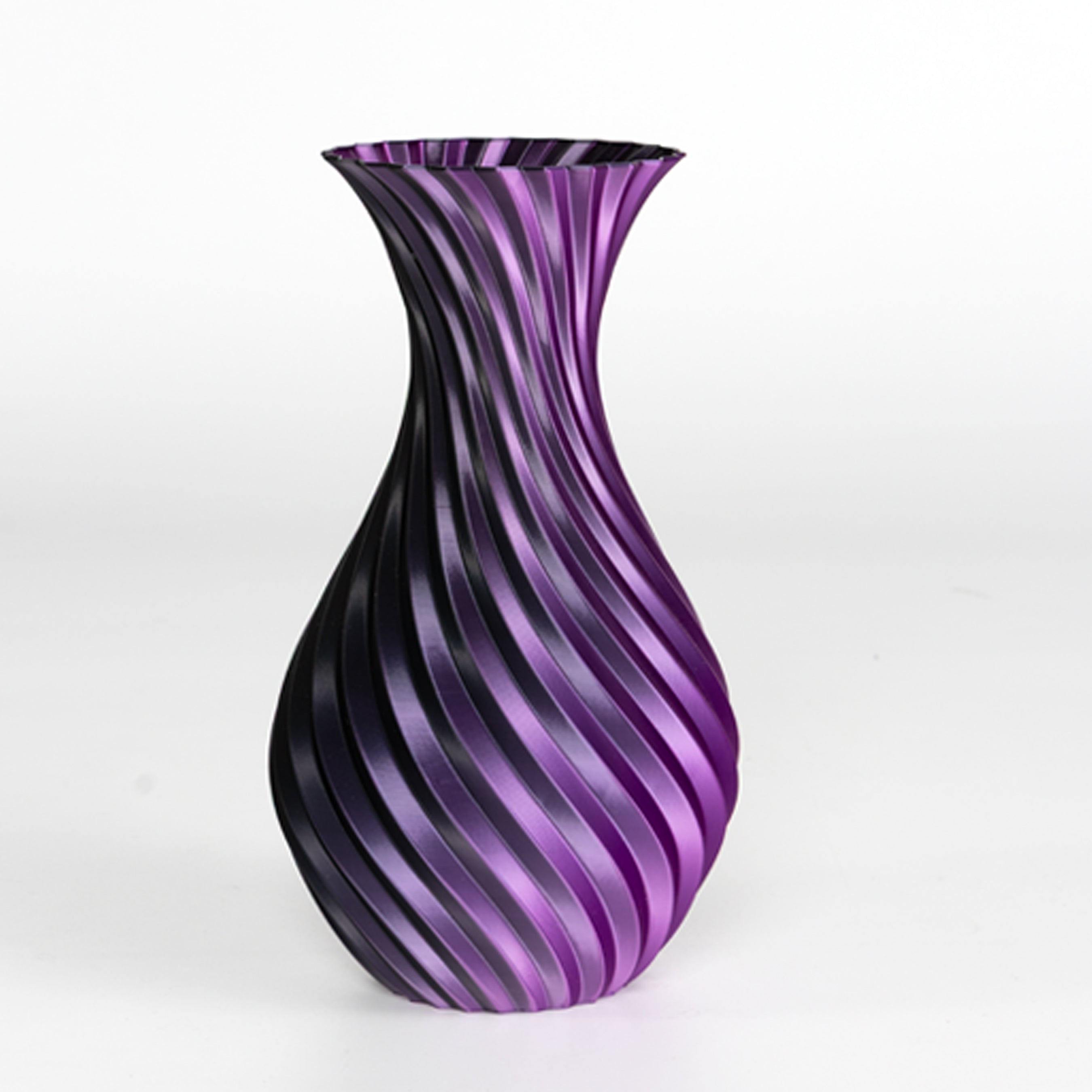 Purple and black striped vase on a white background