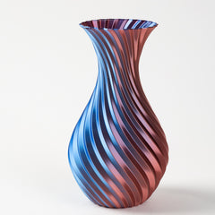 Vase with blue and red striped pattern on a white background