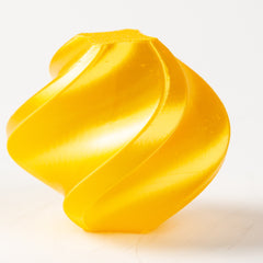 Yellow plastic part on a white background