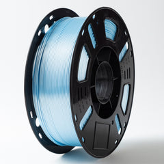 Spool of blue filament on a black plastic spool against a white background