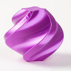 Purple plastic component on a white background