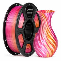 Spool of pink and orange 3D printer filament next to a colorful 3D printed vase on a white background