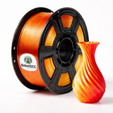 Spool of orange filament with a printed vase on a white background, featuring the RobotGCC brand.