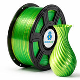 Spool of green filament and a green 3D printed vase on a white background with RobotGCC branding.