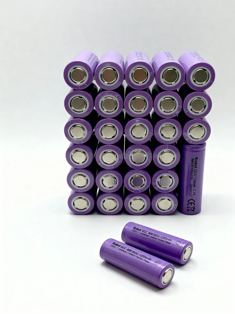Stack of purple batteries on a white background