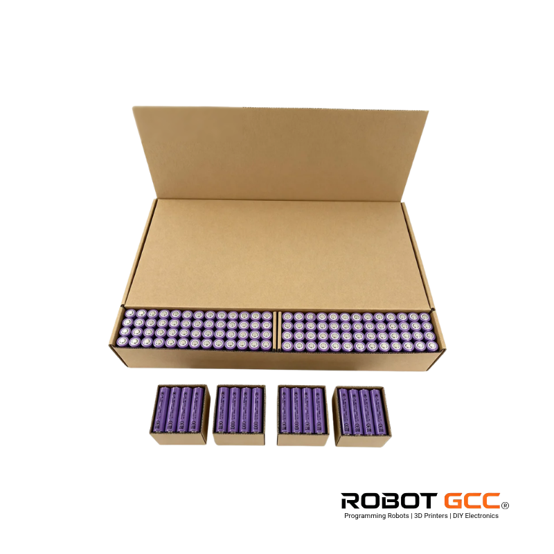 Open cardboard box with purple batteries and Robot GCC branding on a white background