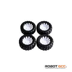 Four black wheels with white centers on a white background, featuring the Robot GCC logo.