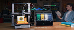 3D printer in operation with a person in the background