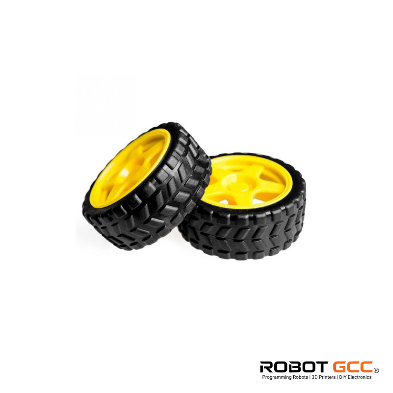 Two black off-road tires with yellow centers on a white background, featuring the ROBOT GCC logo.