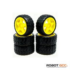 Four black tires with yellow rims on a white background, featuring the ROBOT GCC logo.