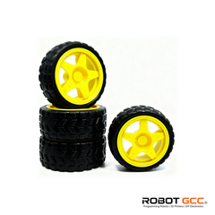 Four black tires with yellow wheels on a white background, featuring the ROBOT GCC logo.