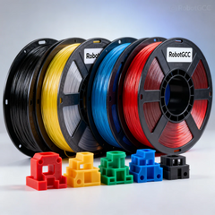 Spools of colorful 3D printing filament with model pieces on a gray background