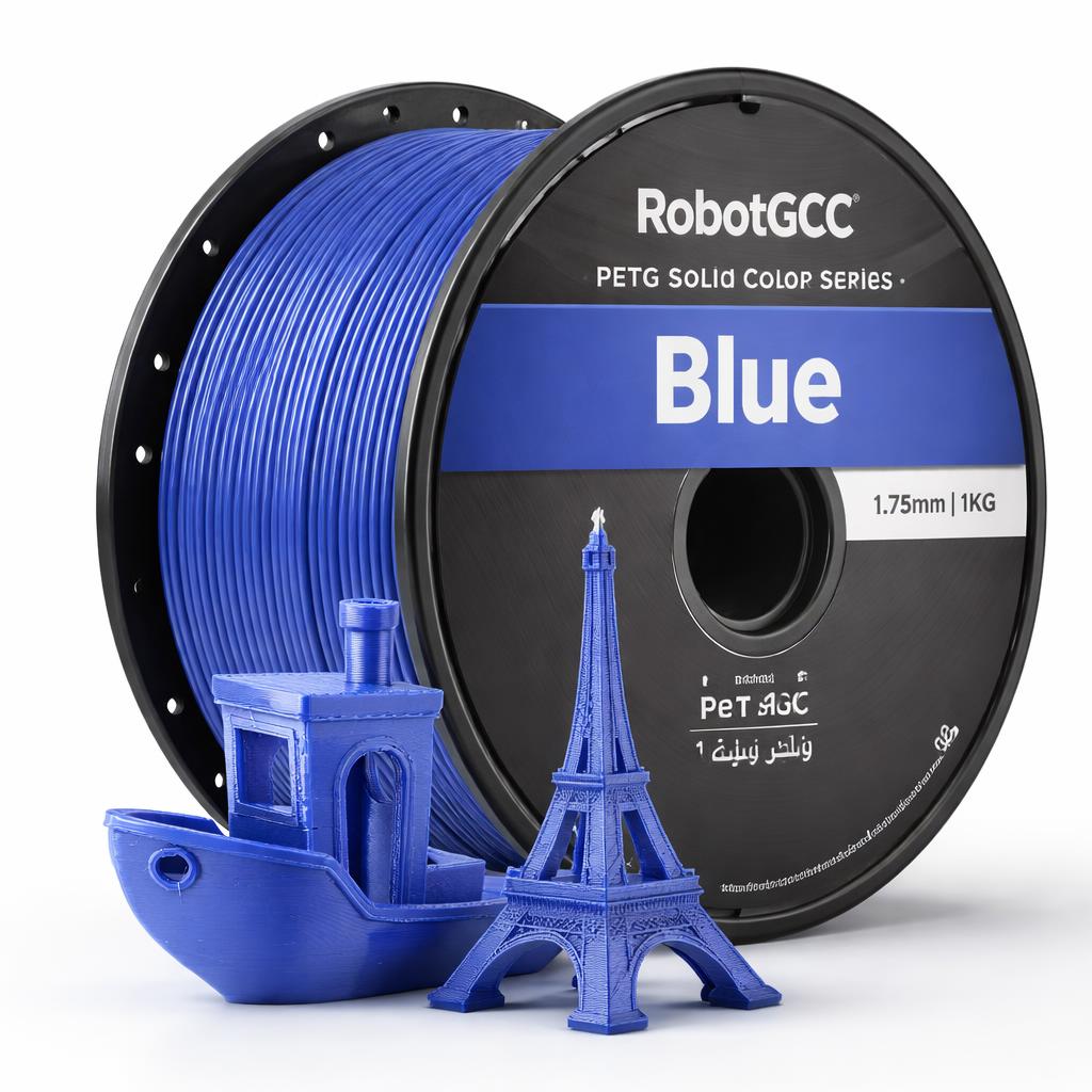 Spool of pink 3D printing filament with a small pink Eiffel Tower and boat model on a white background.