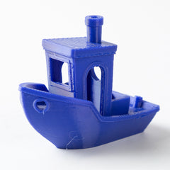 Blue 3D-printed boat model on a white background