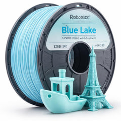 Spool of blue 3D printing filament with 3D printed models on a white background