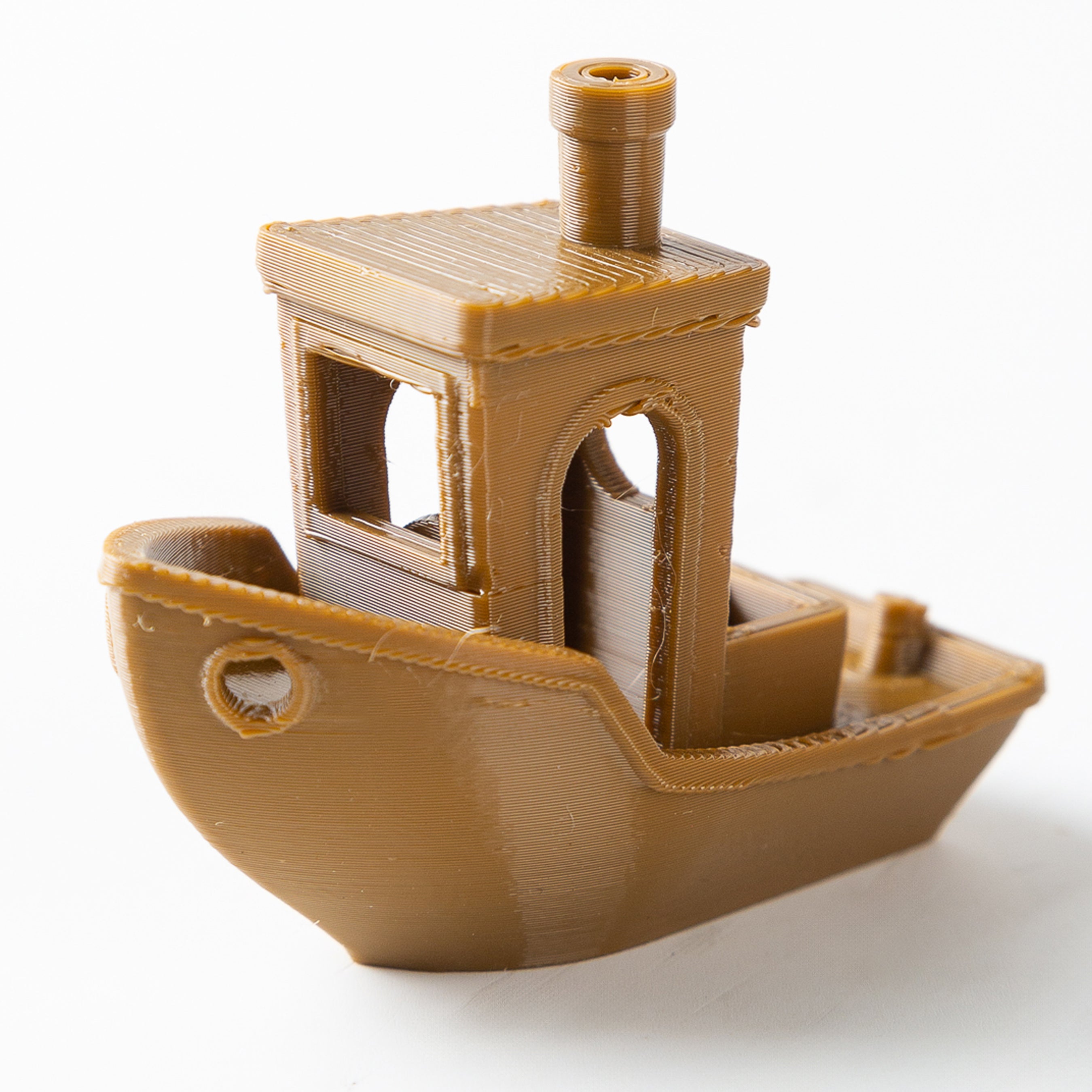 3D-printed model of a ship on a white background