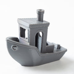 3D-printed model of a small ship on a white background