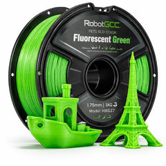 Spool of RobotGCC Fluorescent Green 3D printing filament with 3D prints of a boat and Eiffel Tower.