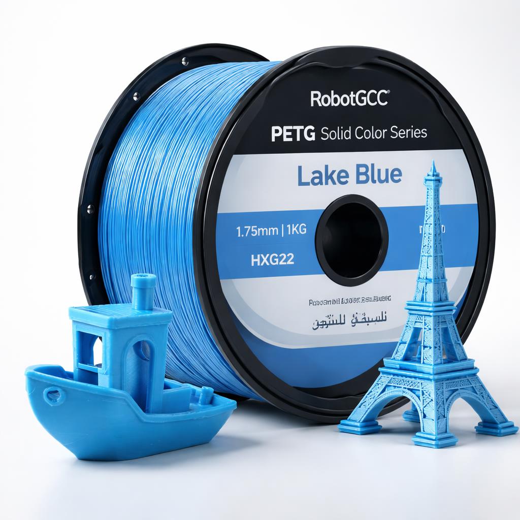 Spool of RobotGCC Lake Blue PETG filament with 3D printed models on a white background