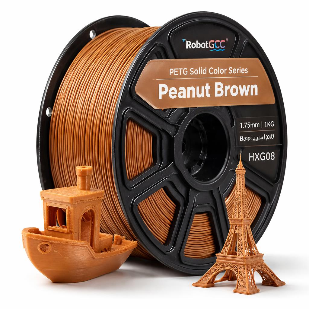 Spool of Peanut Brown 3D printing filament with 3D models of a boat and Eiffel Tower.