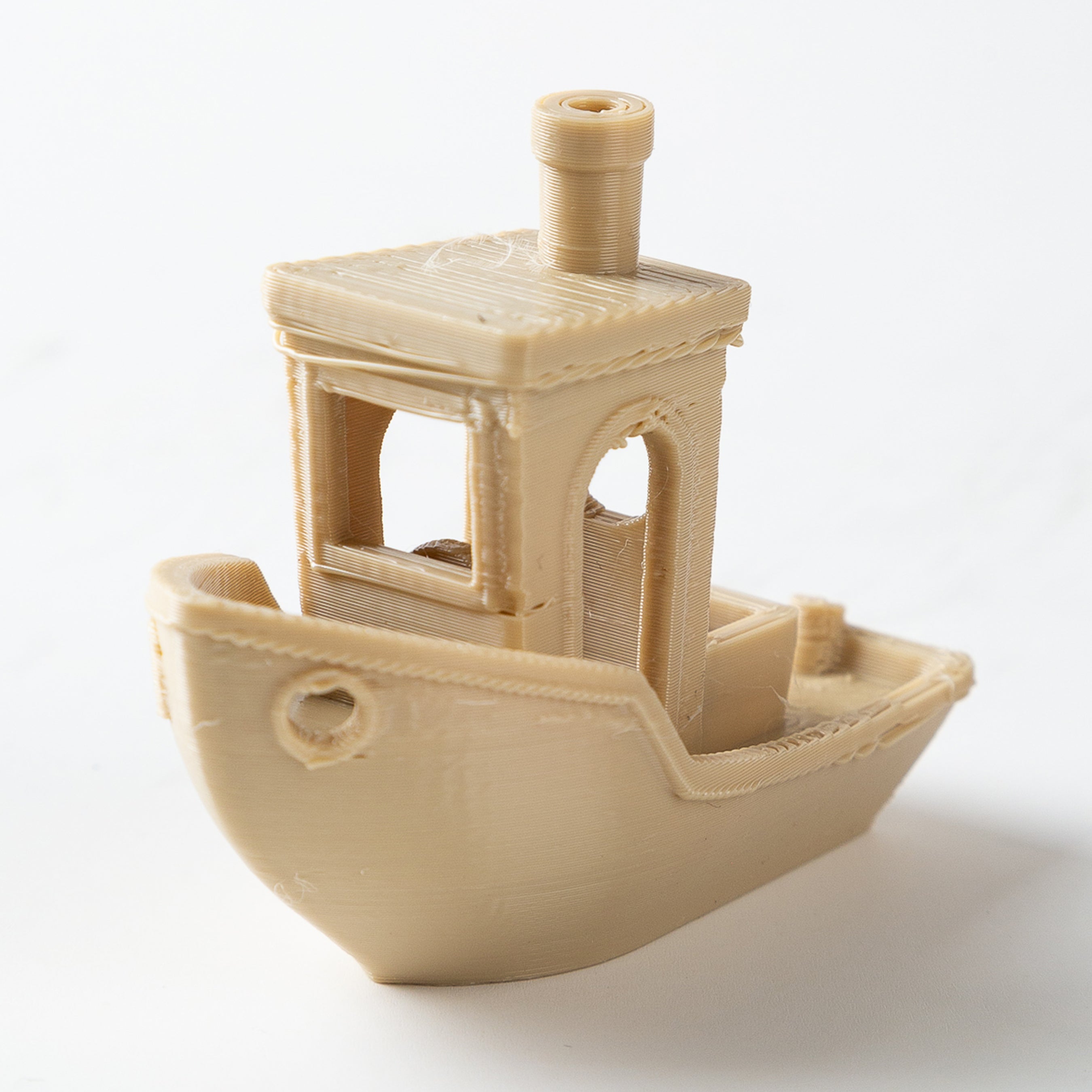 3D-printed model of a ship on a white background