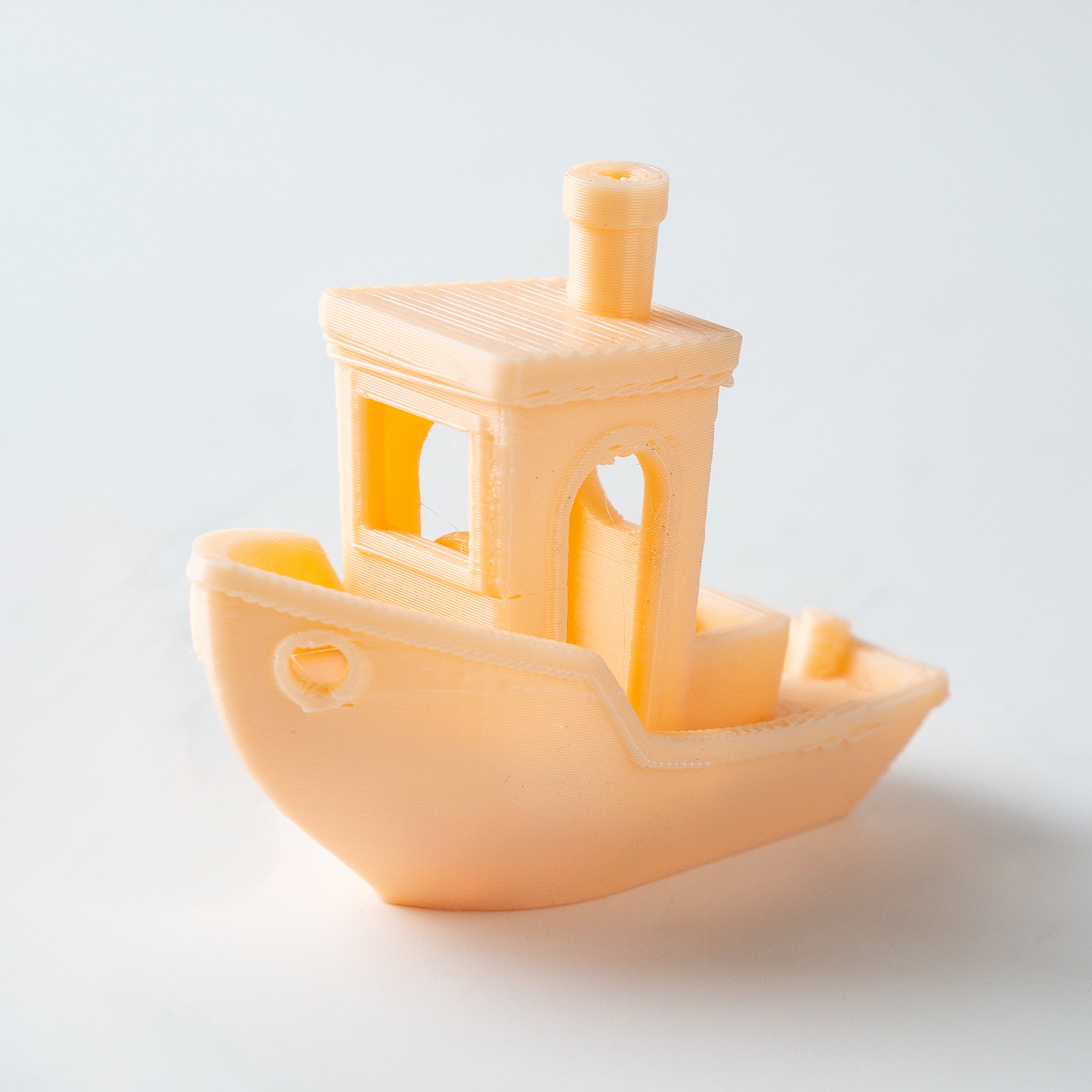 Toy boat with a ladder on a white background