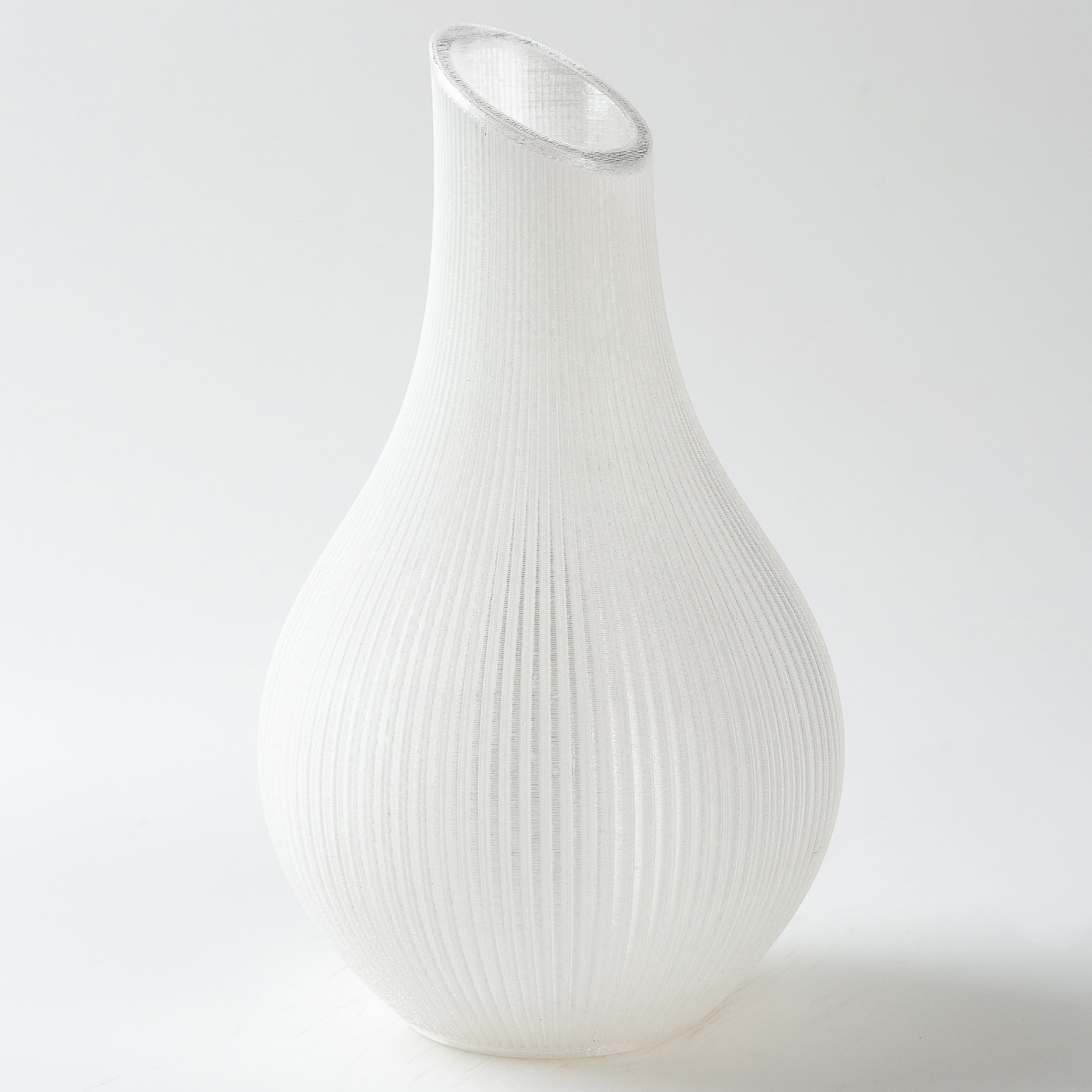 White ribbed vase on a light gray background