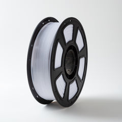 Spool of white filament on a black reel against a white background