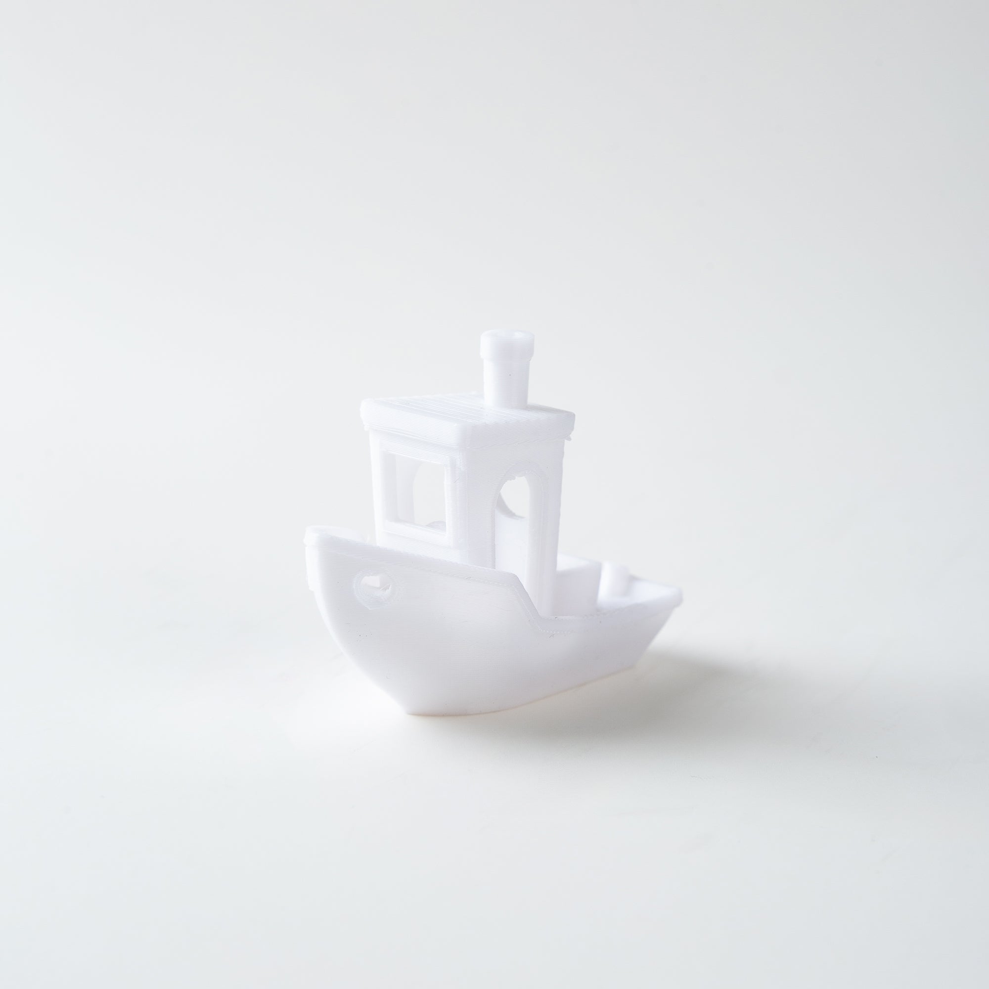 White ceramic boat on a white background